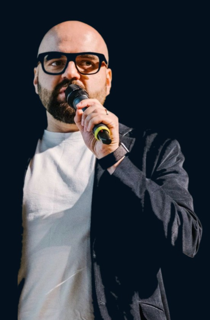 Arkady Sandler speaking at an event